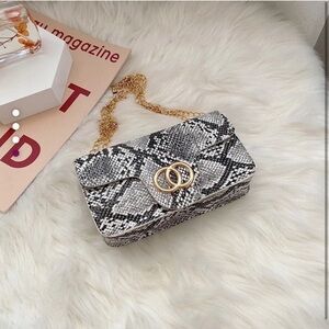 Elegant Snakeskin Clutch with Gold Chain